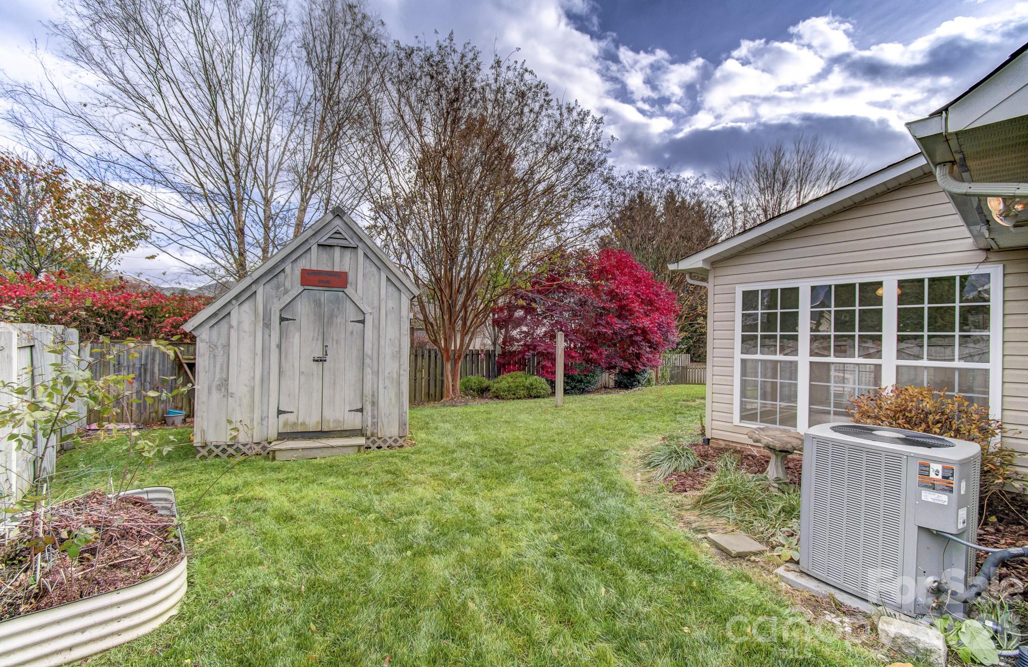 244 Running Briar Road Fletcher, NC 28732 - Photo 40 of 45 a house view with a garden space