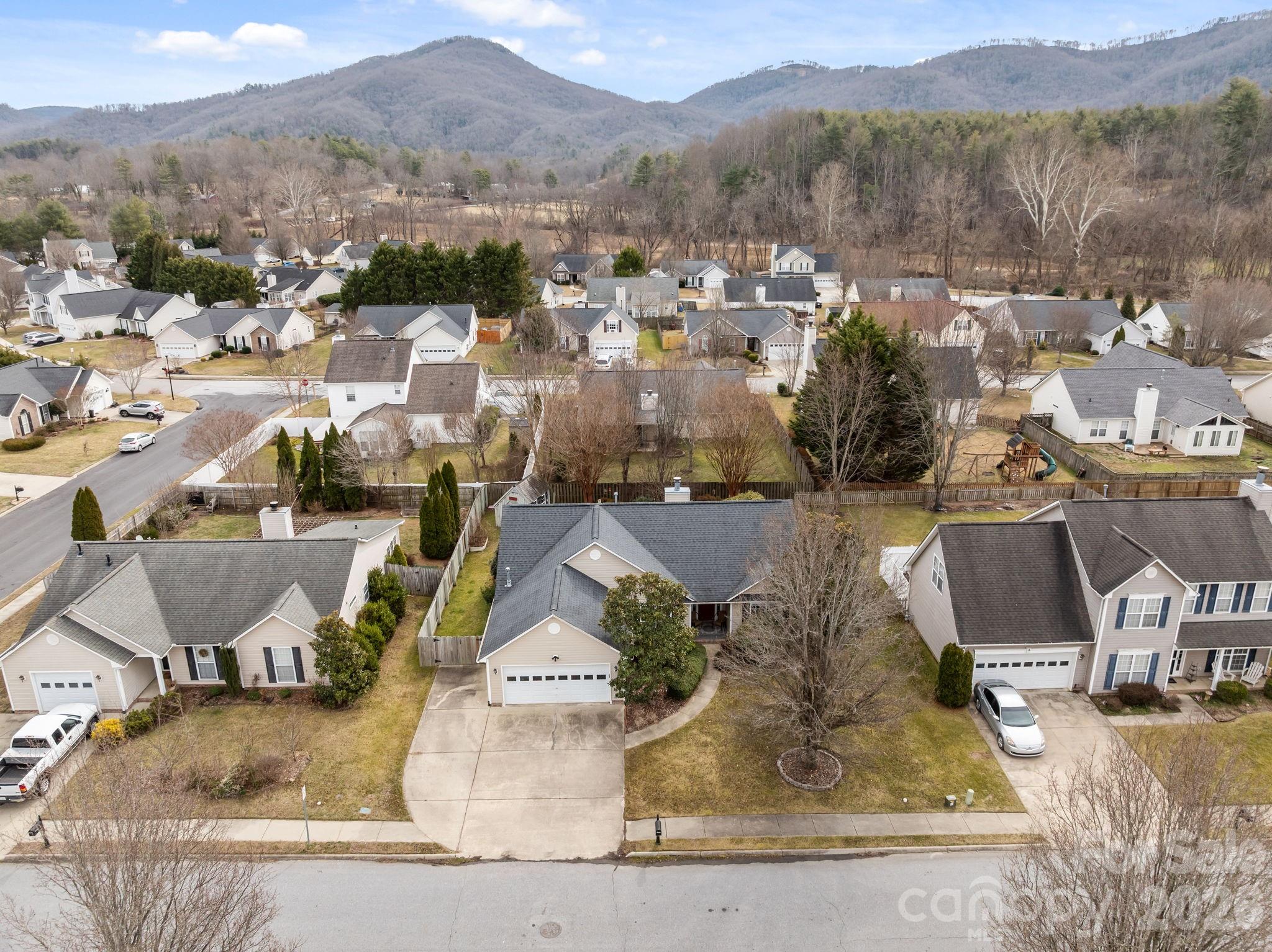 244 Running Briar Road Fletcher, NC 28732 - Photo 43 of 45 an aerial view of a house with a yard swimming pool and mountain view