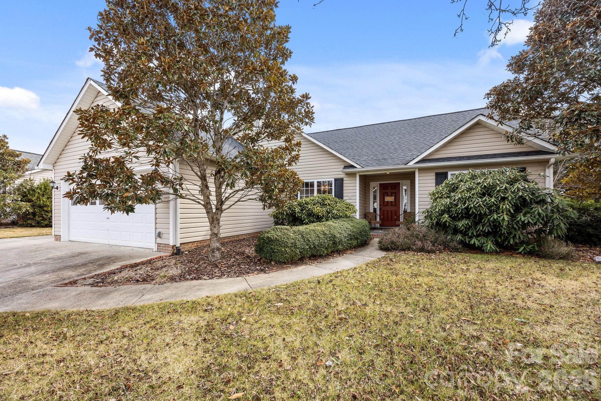 244 Running Briar Road Fletcher, NC 28732 - Photo 5 of 45 a front view of a house with a yard and garage