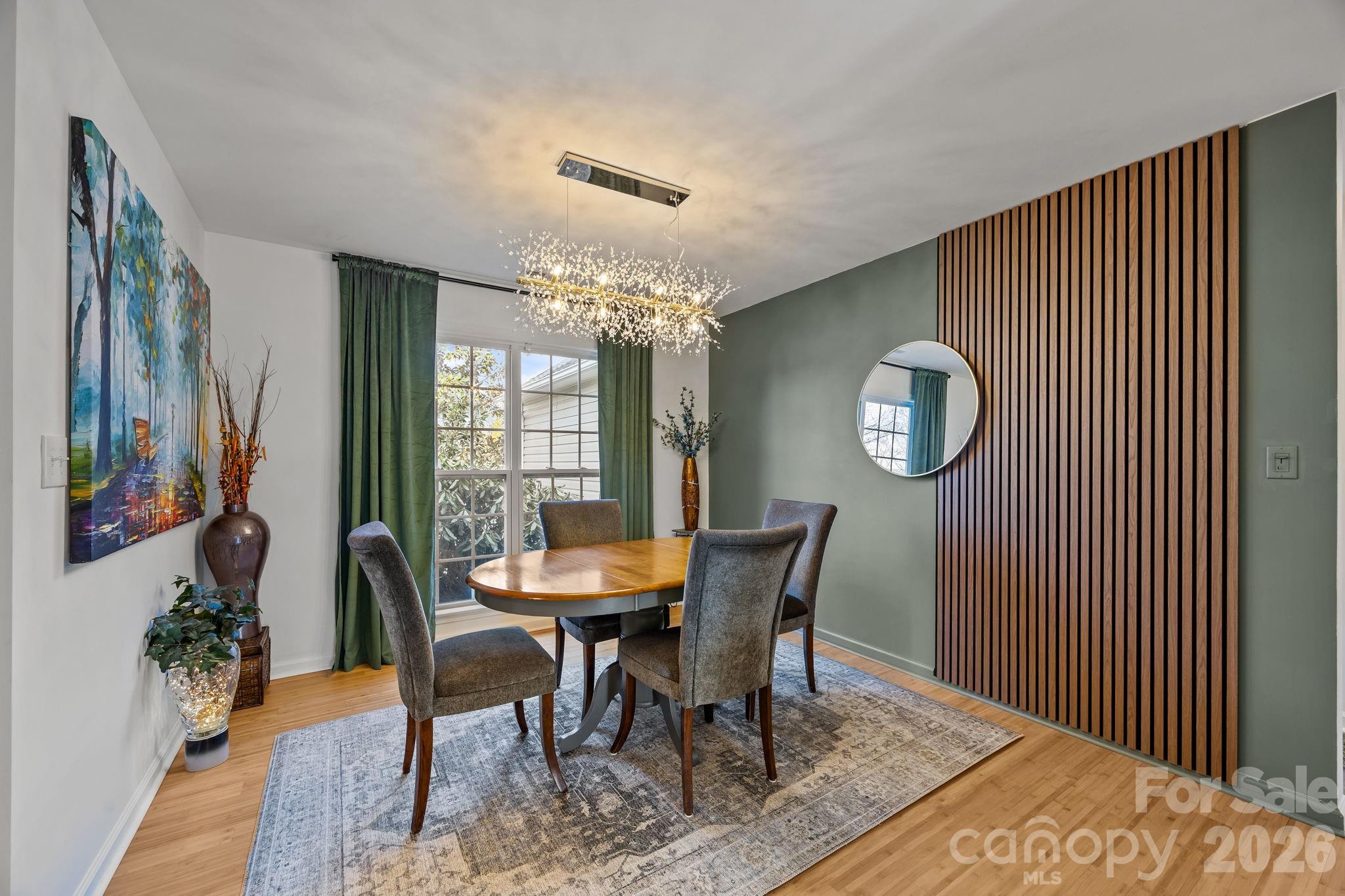 244 Running Briar Road Fletcher, NC 28732 - Photo 7 of 45 a view of a dining room with furniture and wooden floor