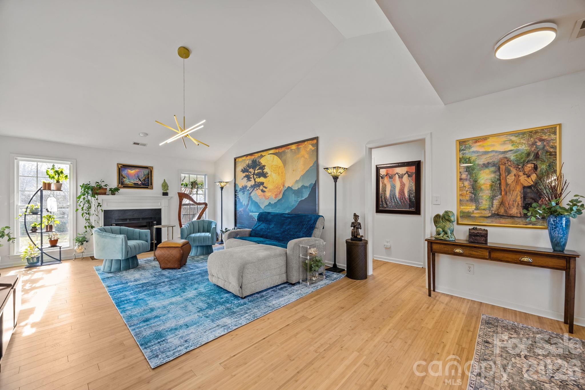 244 Running Briar Road Fletcher, NC 28732 - Photo 9 of 45 a living room with furniture and a wooden floor