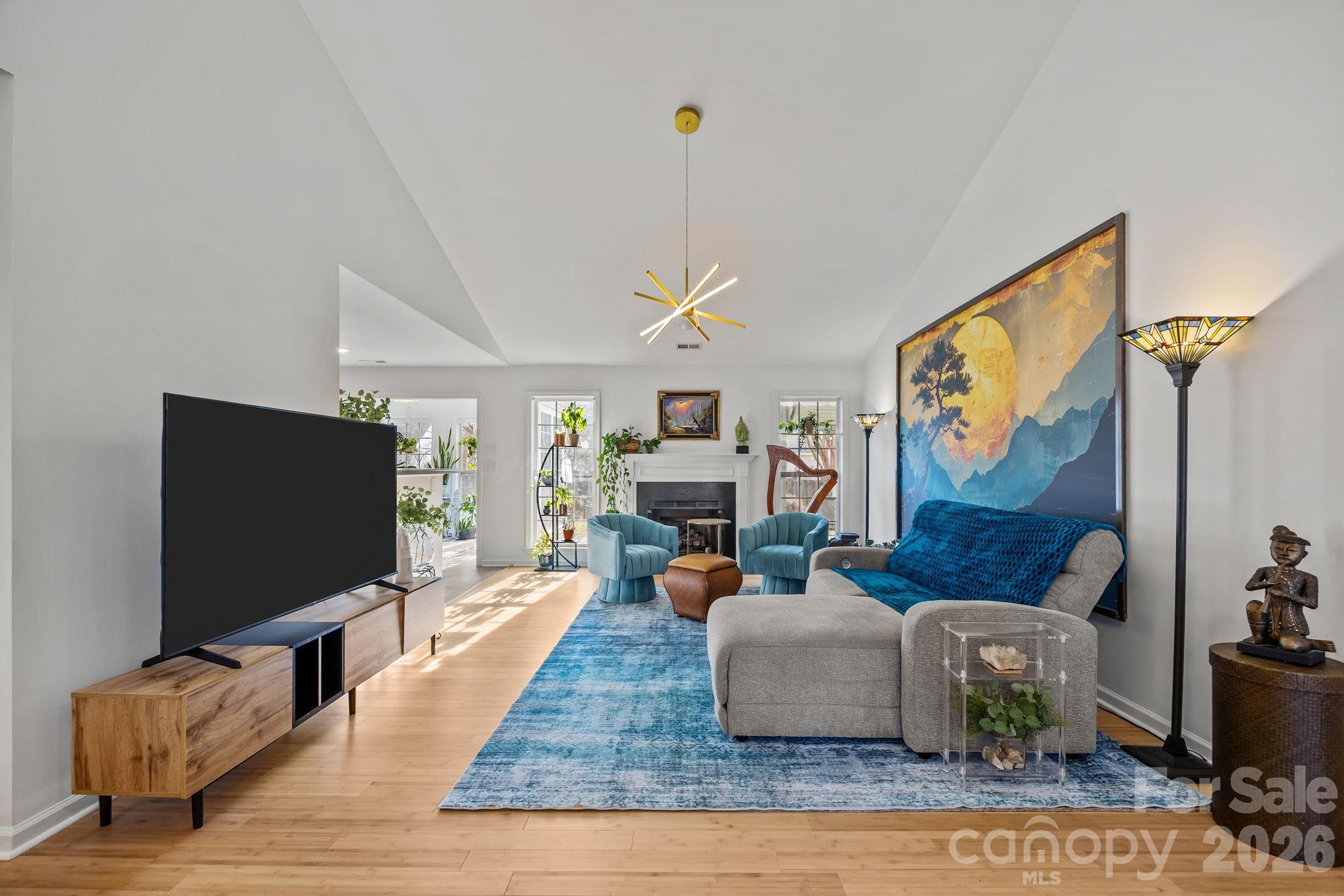 244 Running Briar Road Fletcher, NC 28732 - Photo 10 of 45 a living room with furniture and a flat screen tv