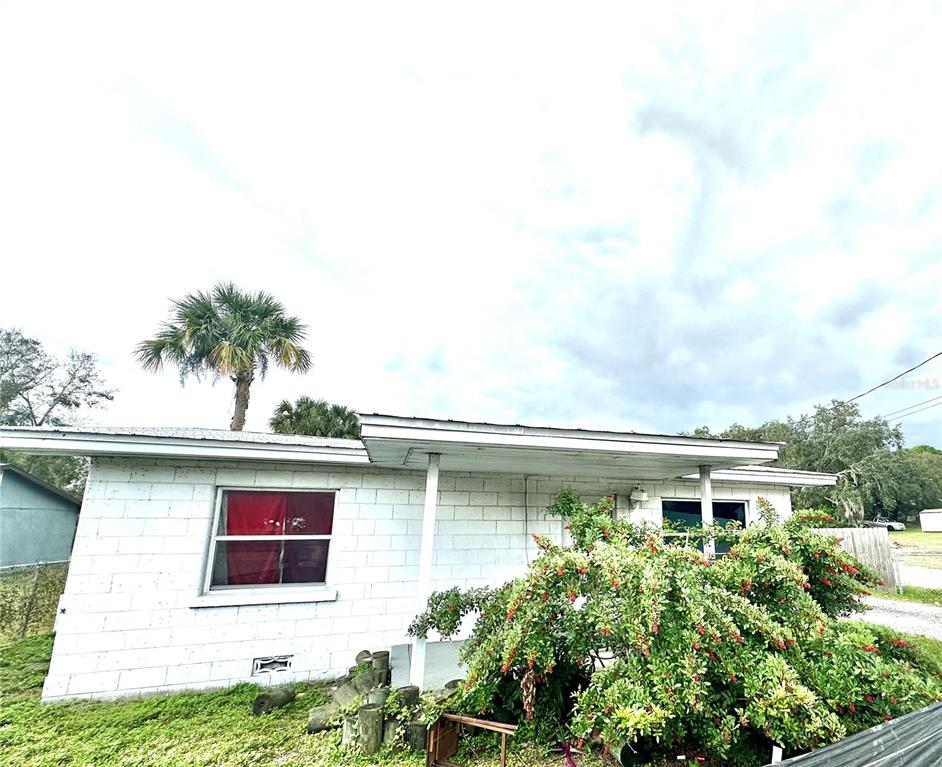 615 Clearlake Road Cocoa, FL 32922 - Photo 1 of 1 a view of a house with pool and a yard