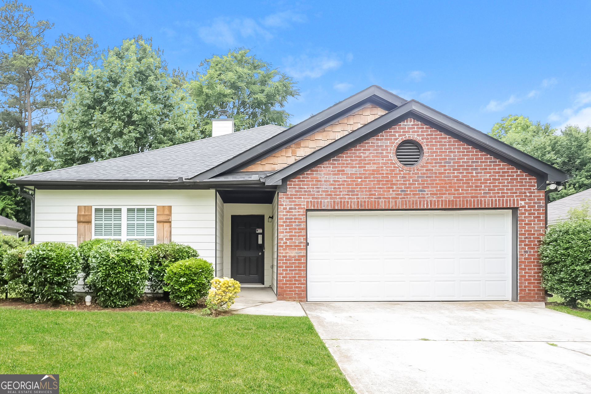 5517 Jerome Road South Fulton, GA 30349 - Photo 1 of 16 a front view of a house with a yard and garage