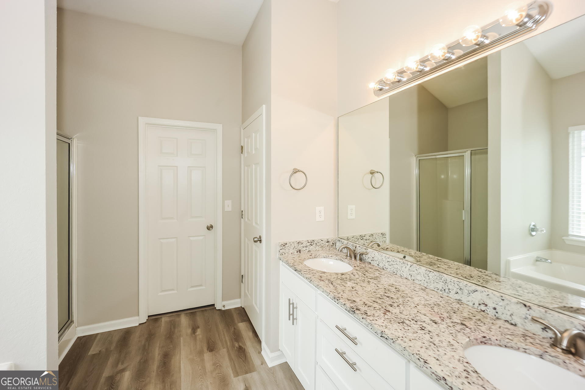 5517 Jerome Road South Fulton, GA 30349 - Photo 11 of 16 a bathroom with a granite countertop sink and a mirror
