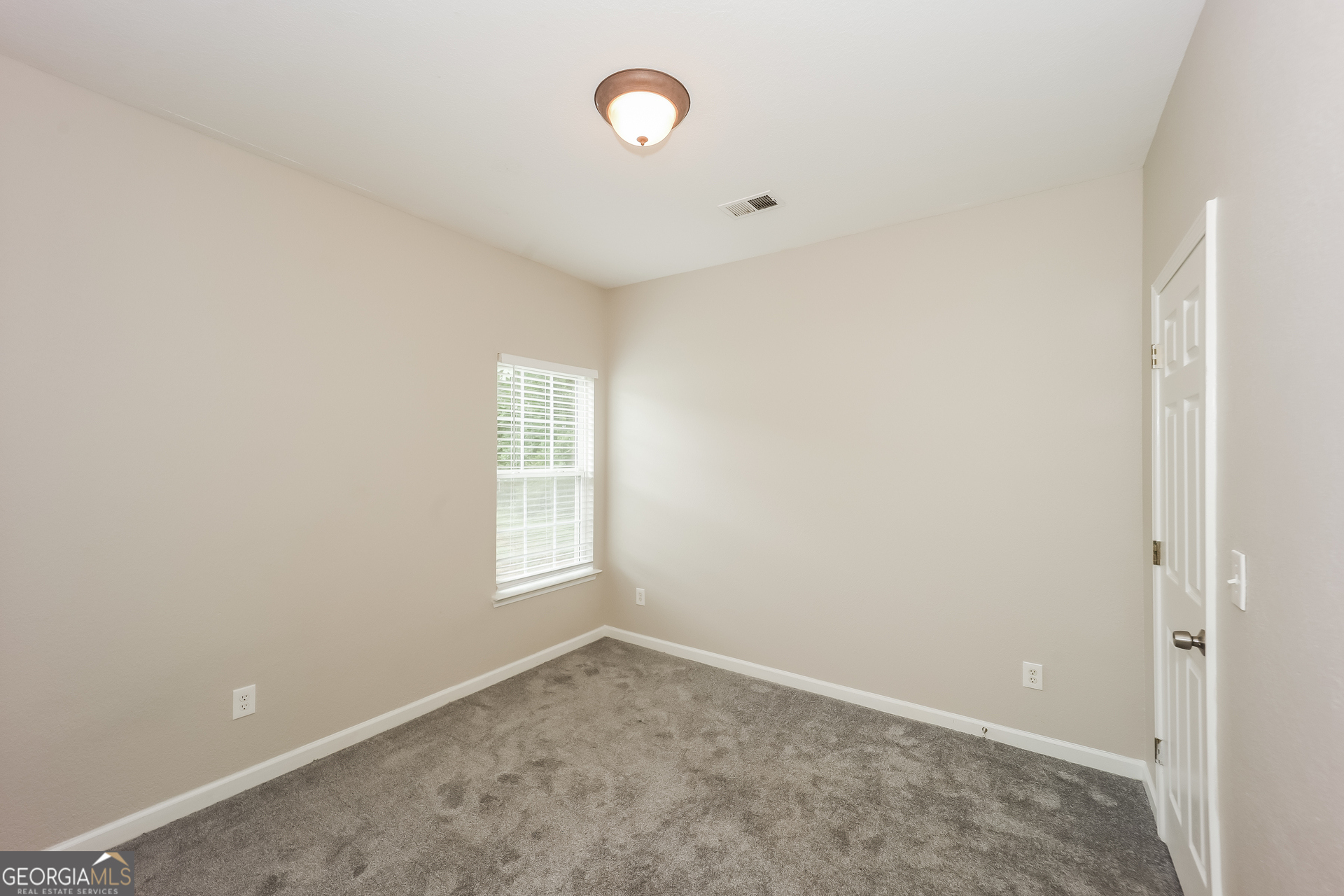 5517 Jerome Road South Fulton, GA 30349 - Photo 12 of 16 an empty room with a window