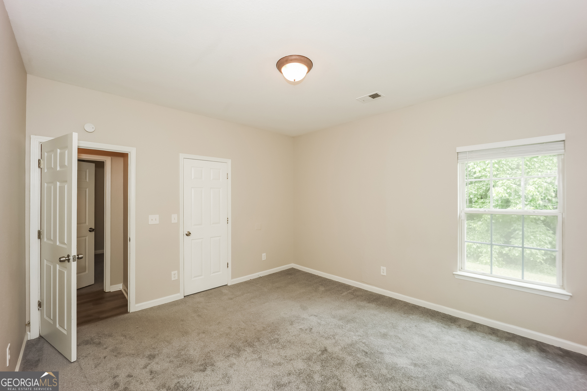 5517 Jerome Road South Fulton, GA 30349 - Photo 14 of 16 an empty room with windows