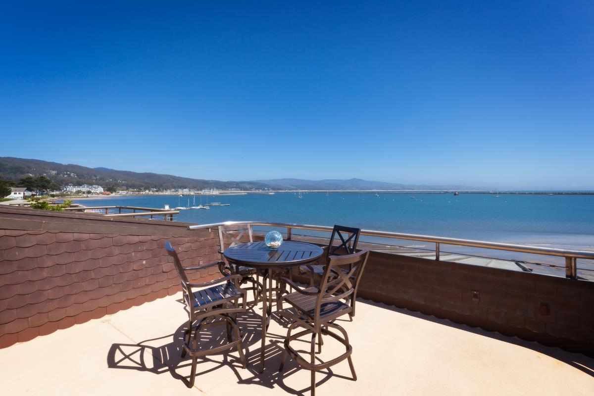 123 Ocean Boulevard Half Moon Bay, CA 94019 - Photo 1 of 30 a view of a terrace with furniture and stove