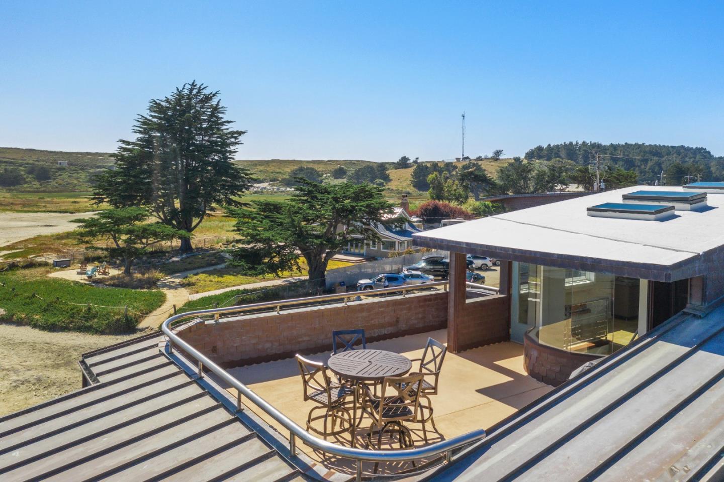 123 Ocean Boulevard Half Moon Bay, CA 94019 - Photo 26 of 30 a view of a patio with swimming pool table and chairs
