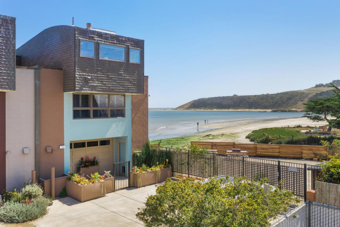 123 Ocean Boulevard Half Moon Bay, CA 94019 - Photo 30 of 30 a front view of a house with a lake view