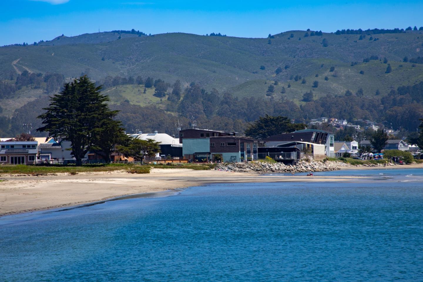 123 Ocean Boulevard Half Moon Bay, CA 94019 - Photo 4 of 30 a view of a town with mountains in the background