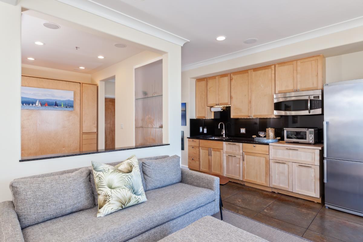 123 Ocean Boulevard Half Moon Bay, CA 94019 - Photo 6 of 30 a living room with stainless steel appliances furniture and a window