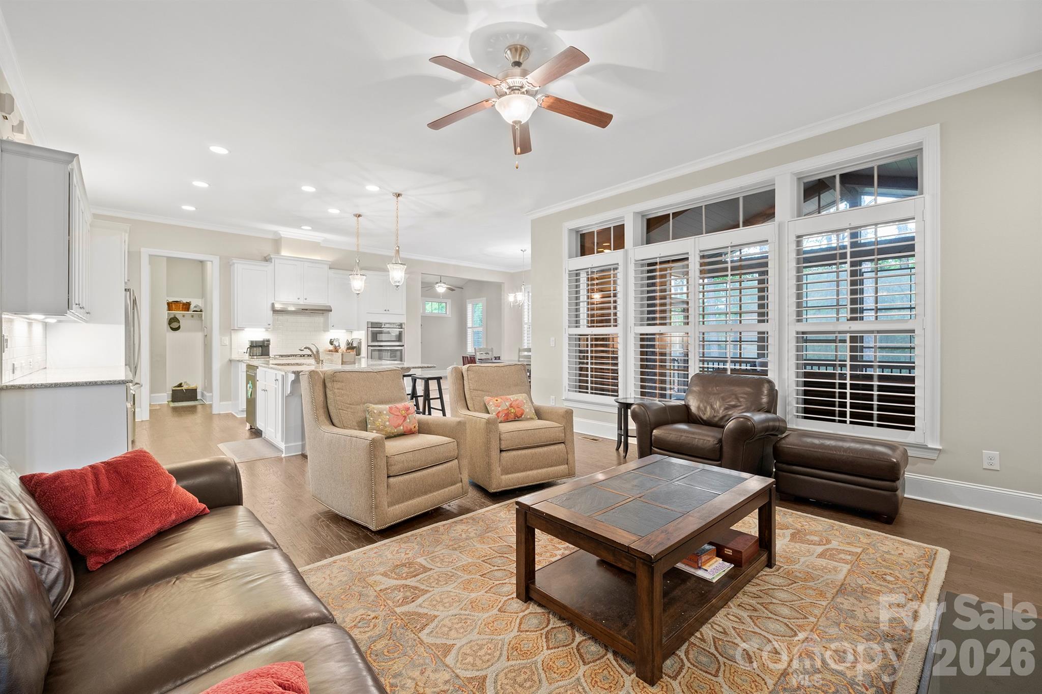 13044 Fen Court Huntersville, NC 28078 - Photo 11 of 43 a living room with furniture ceiling fan and a rug