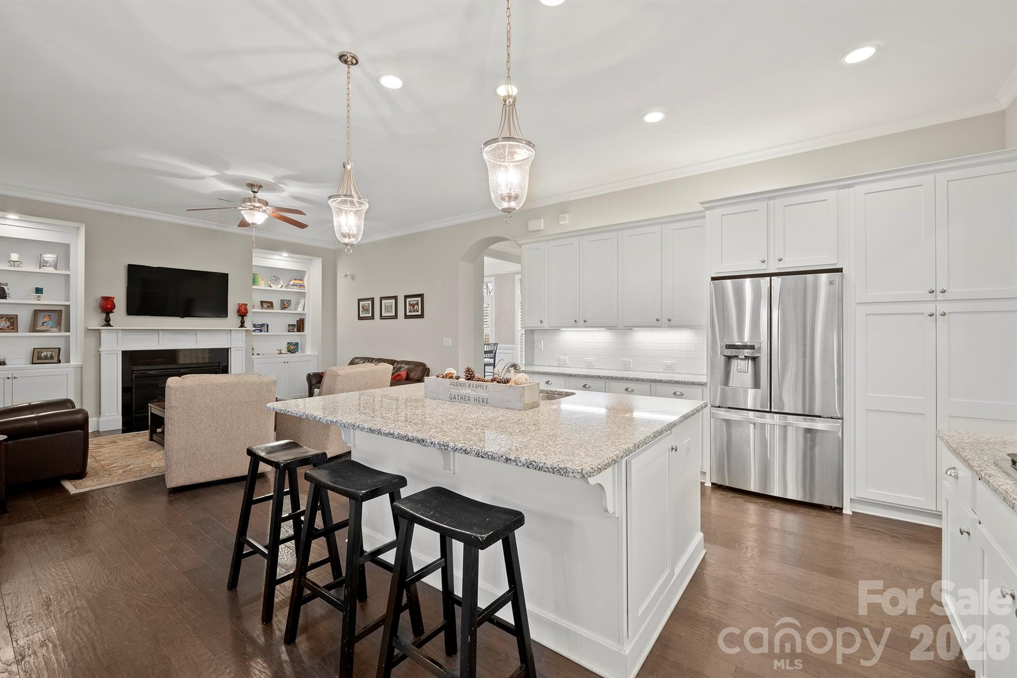 13044 Fen Court Huntersville, NC 28078 - Photo 13 of 43 a kitchen with kitchen island a large counter top space appliances and cabinets