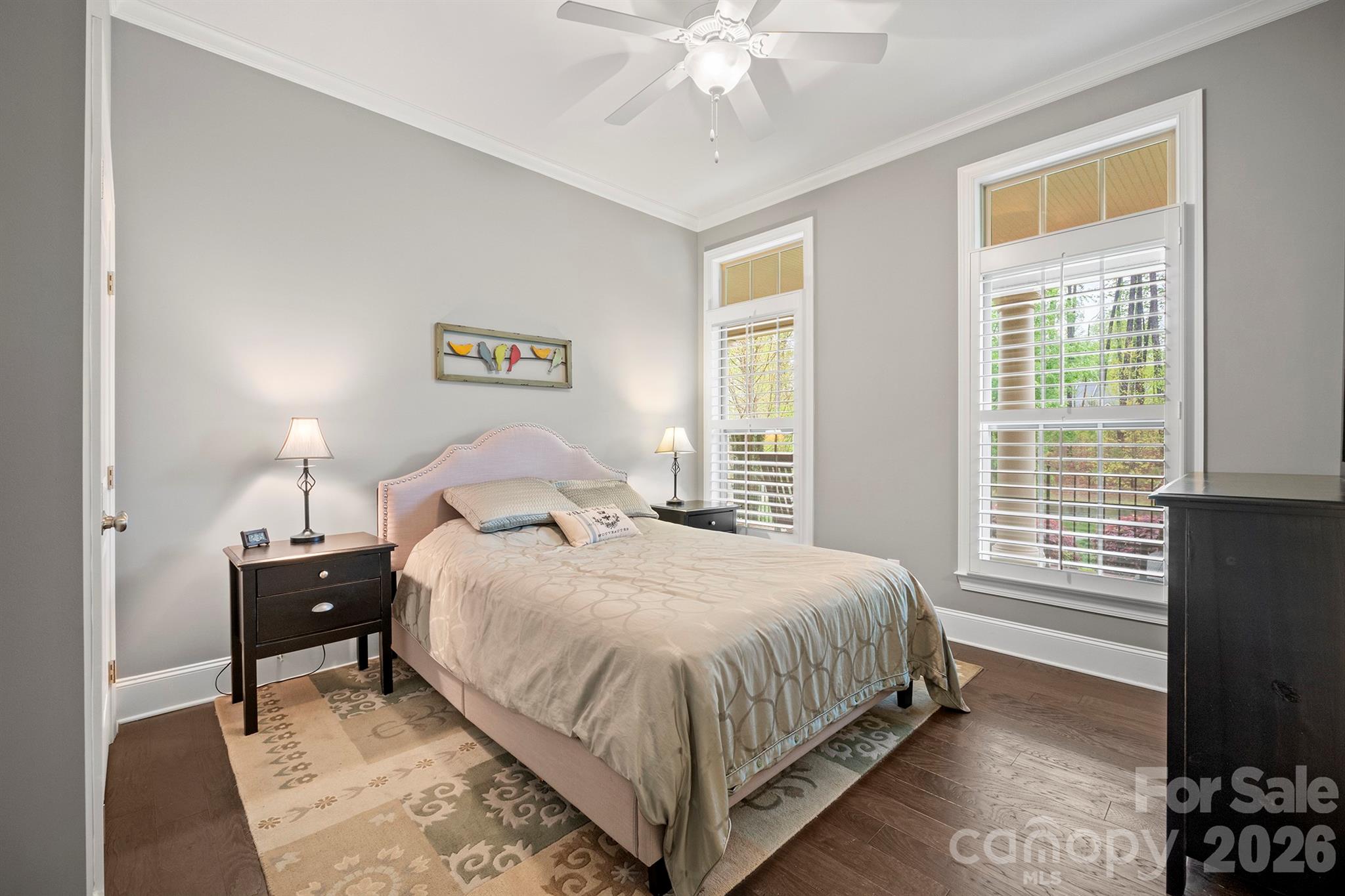 13044 Fen Court Huntersville, NC 28078 - Photo 19 of 43 a bedroom with a bed and a chandelier