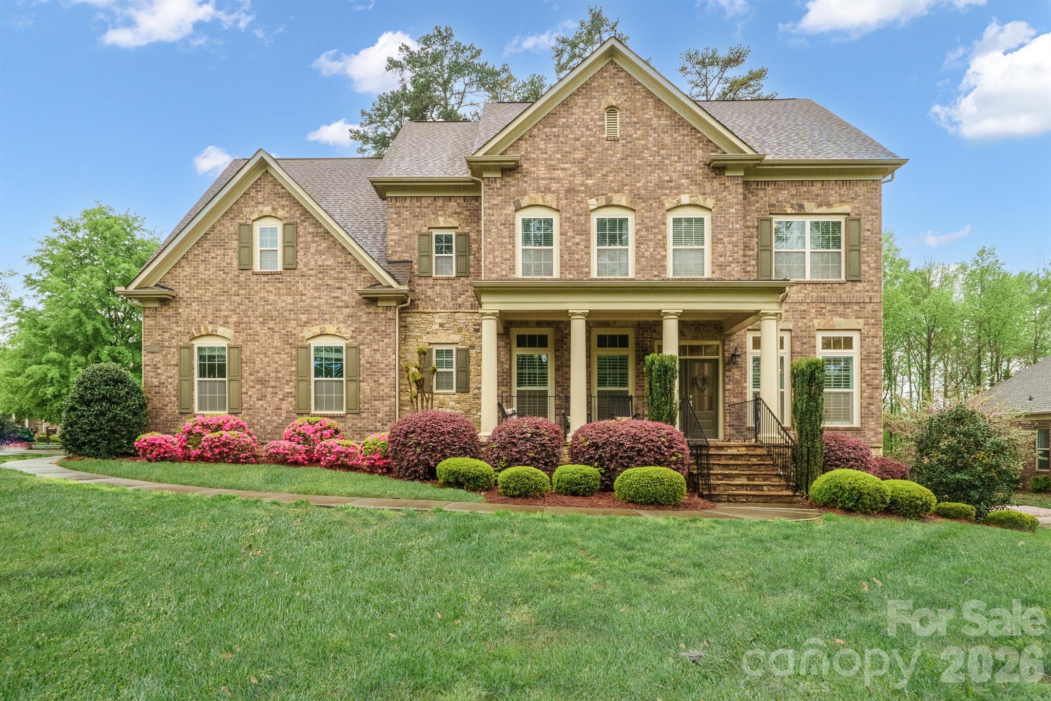 13044 Fen Court Huntersville, NC 28078 - Photo 2 of 43 a front view of a house with garden