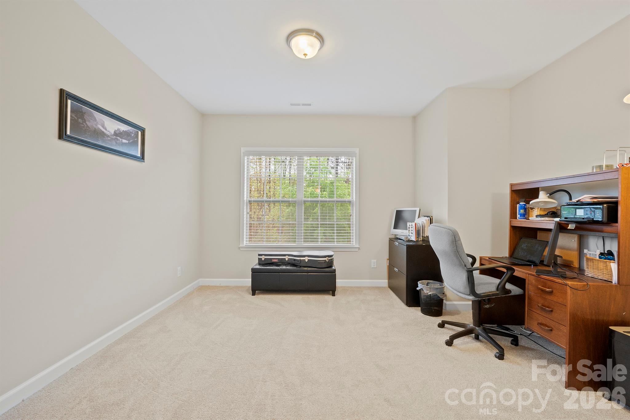 13044 Fen Court Huntersville, NC 28078 - Photo 24 of 43 a view of a workspace with furniture and a window