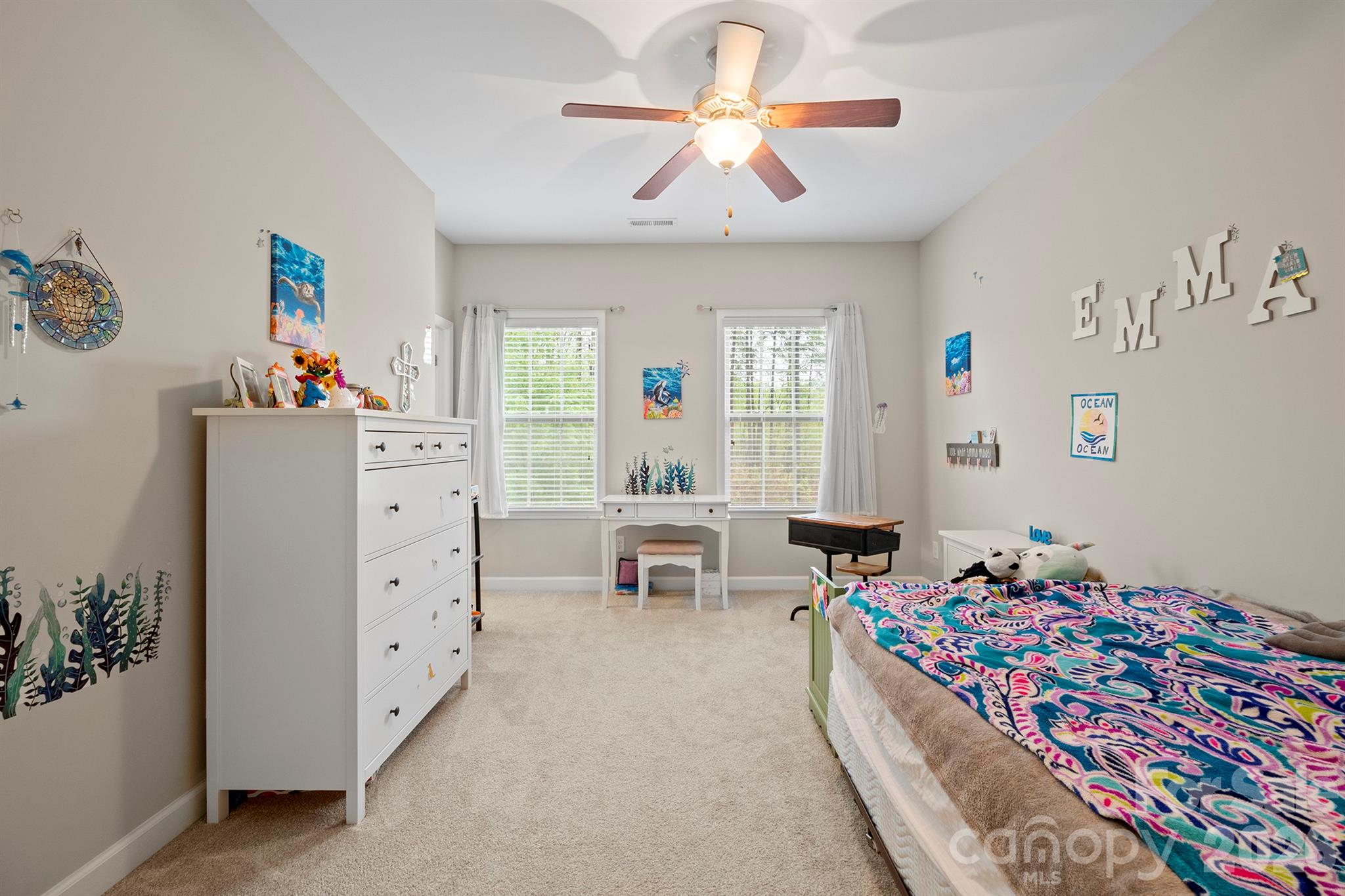 13044 Fen Court Huntersville, NC 28078 - Photo 31 of 43 a bedroom with furniture and a chandelier