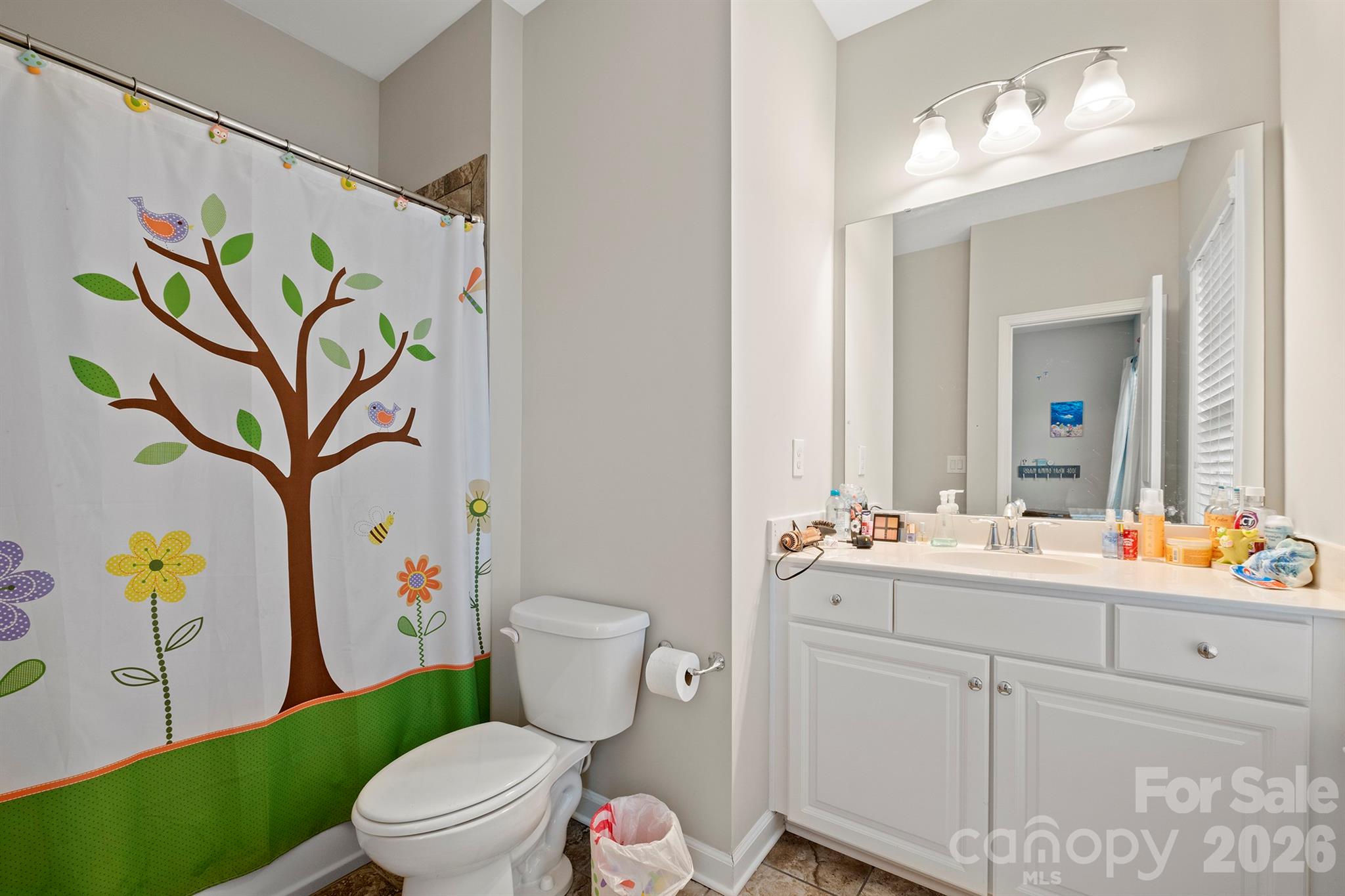 13044 Fen Court Huntersville, NC 28078 - Photo 32 of 43 a bathroom with a sink mirror vanity and toilet