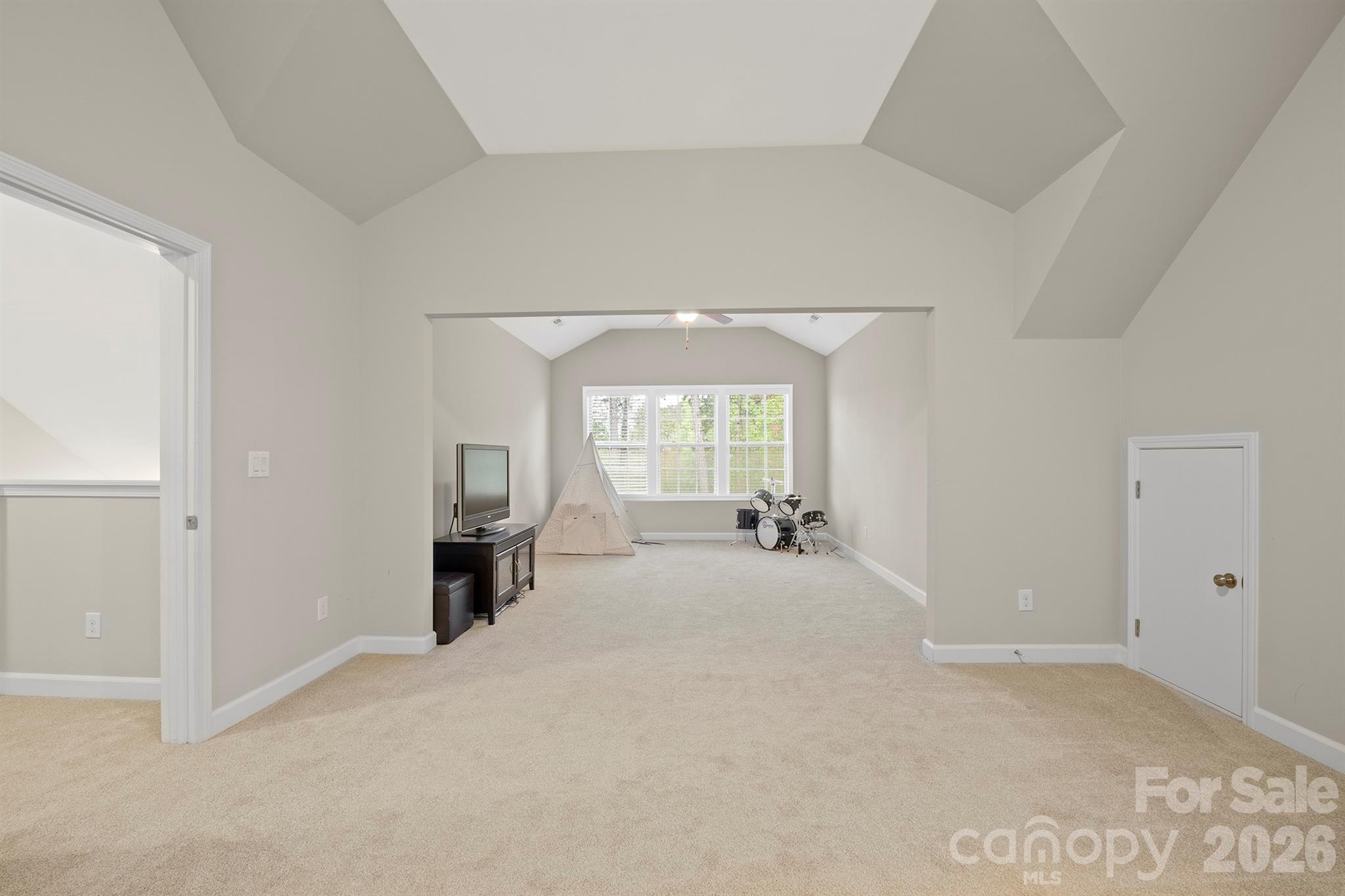 13044 Fen Court Huntersville, NC 28078 - Photo 34 of 43 a view of an empty room with a fireplace and a window