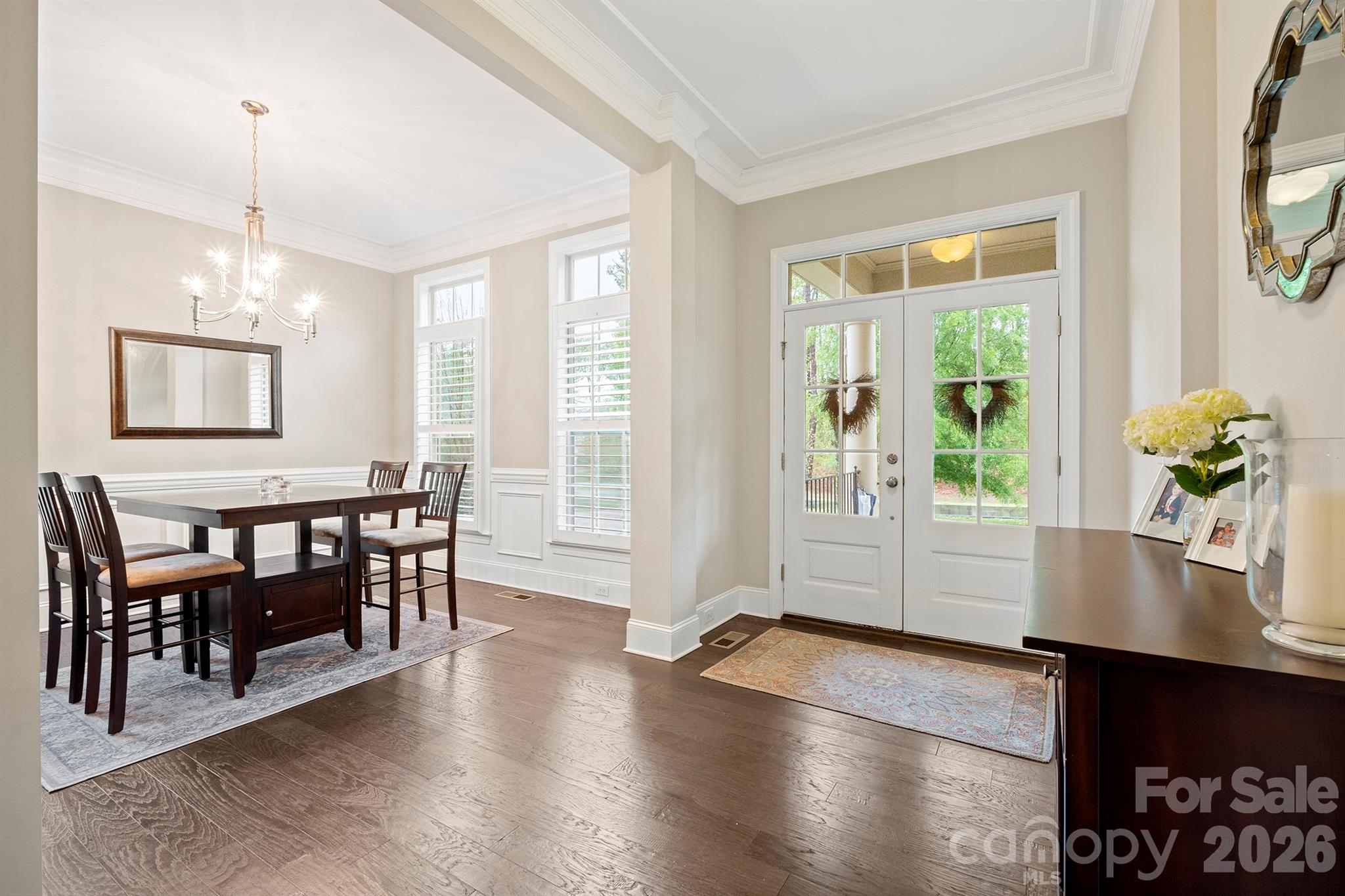 13044 Fen Court Huntersville, NC 28078 - Photo 7 of 43 a view of a dining room with furniture window and wooden floor