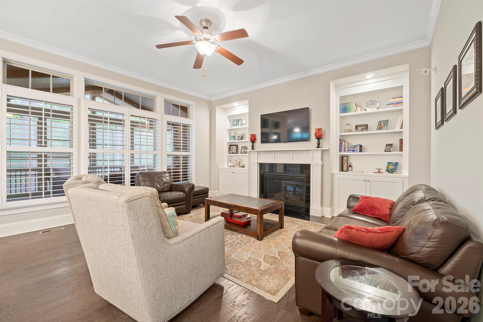 13044 Fen Court Huntersville, NC 28078 - Photo 9 of 43 a living room with furniture fireplace and a flat screen tv