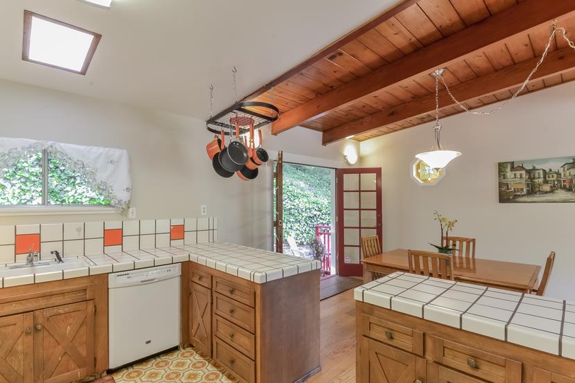 712 Ursula Avenue Pacifica, CA 94044 - Photo 12 of 42 a open kitchen with a sink cabinets and wooden floor