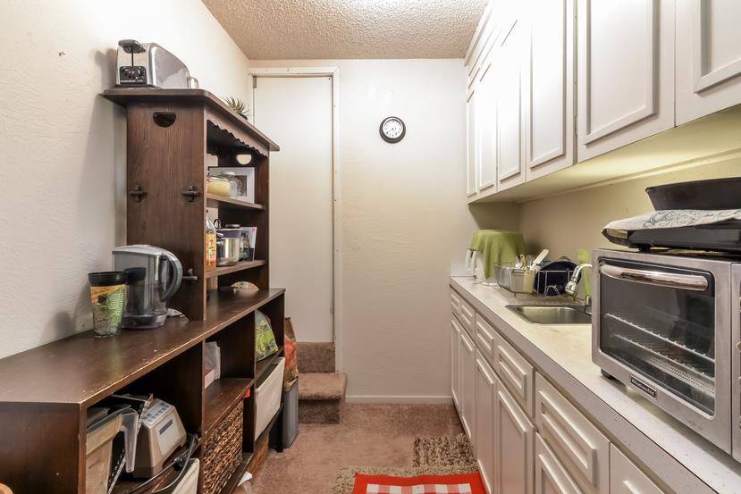 712 Ursula Avenue Pacifica, CA 94044 - Photo 25 of 42 a kitchen with cabinets and appliances