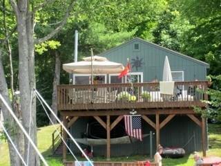 49 Marsh Point Morris, CT 06763 - Photo 1 of 1 a front view of house with deck and outdoor seating