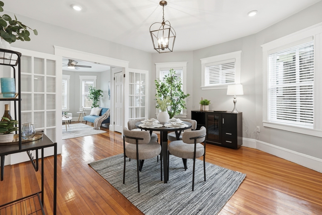 20 Ripley Road, Unit 3 Boston, MA 02121 - Photo 7 of 27 a view of a dining room with furniture window and wooden floor
