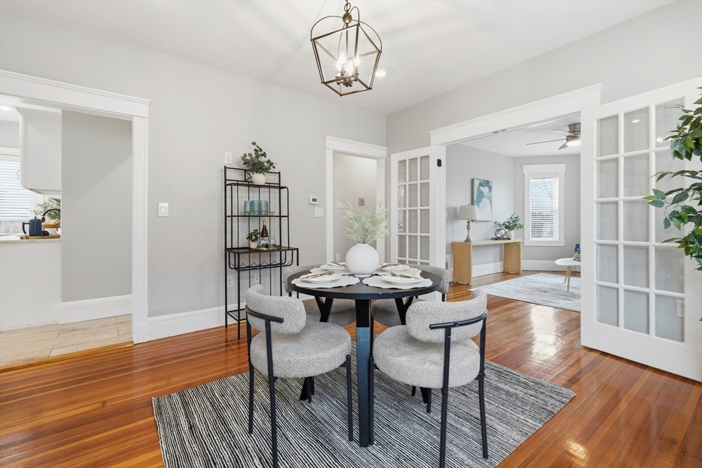 20 Ripley Road, Unit 3 Boston, MA 02121 - Photo 8 of 27 a view of a dining room with furniture wooden floor and chandelier