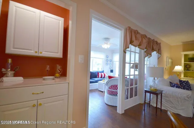 a view of living room kitchen and entryway