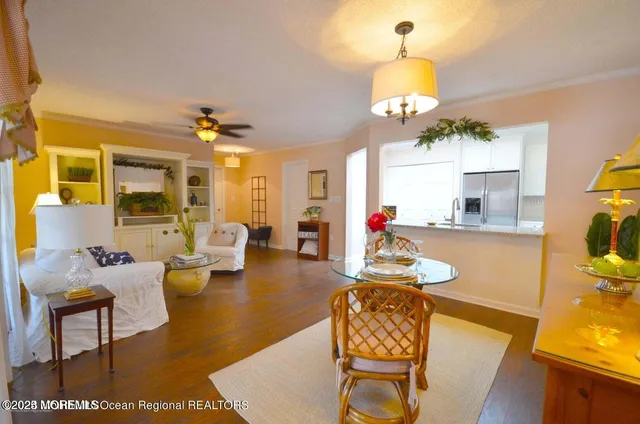 a living room with fireplace furniture and a chandelier