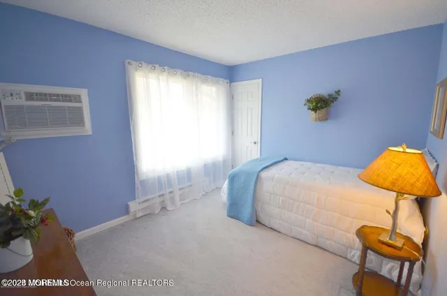 a bedroom with a bed and lamps