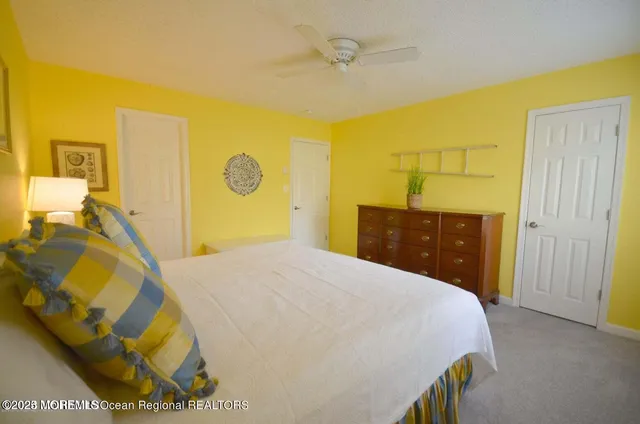 a bedroom with a bed and dresser