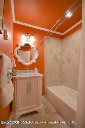 a bathroom with a bath tub