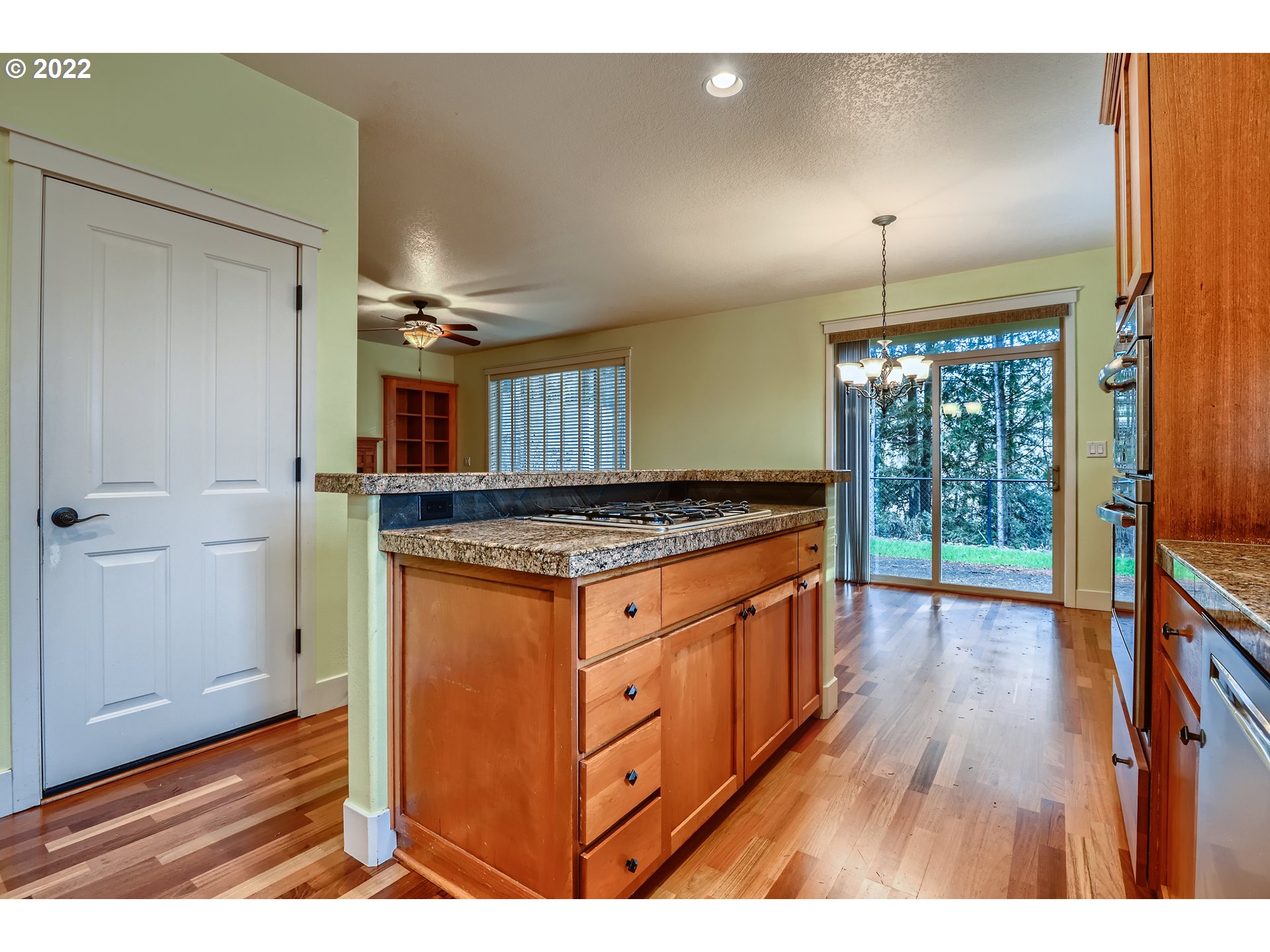 14656 Southwest 164th Avenue Tigard, OR 97224 - Photo 13 of 31 a open kitchen with granite countertop a sink and a stove