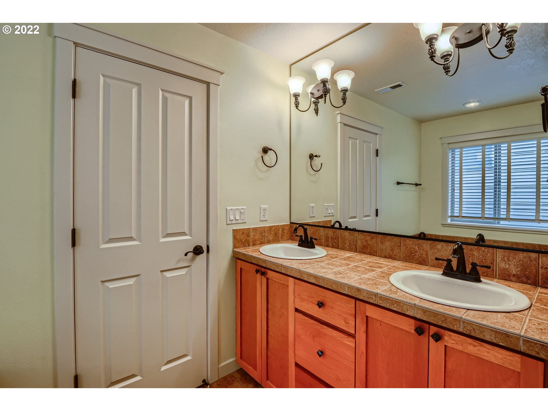 14656 Southwest 164th Avenue Tigard, OR 97224 - Photo 20 of 31 a bathroom with a granite countertop sink a mirror and a shower