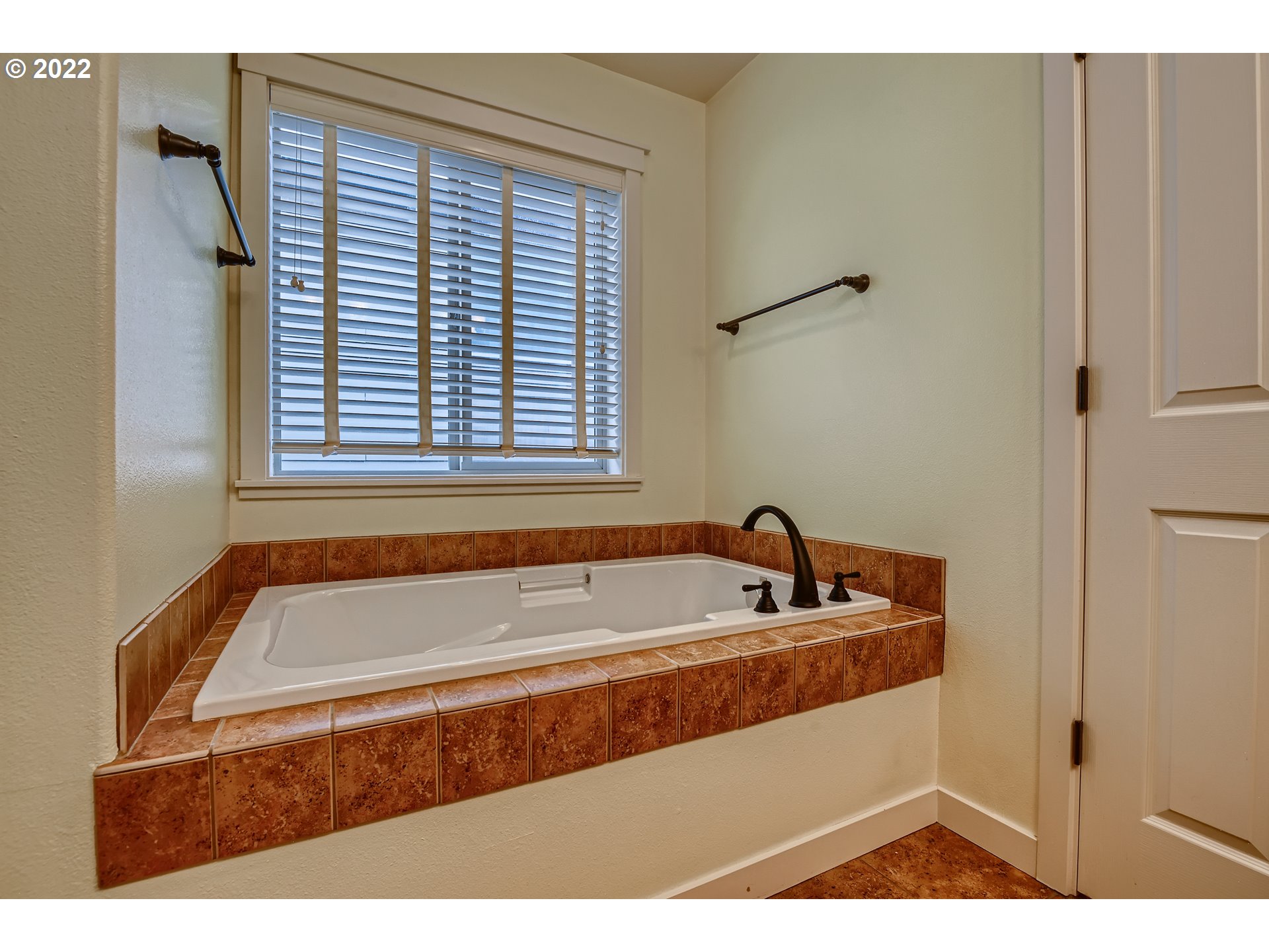 14656 Southwest 164th Avenue Tigard, OR 97224 - Photo 21 of 31 a bathroom with a bathtub and a window