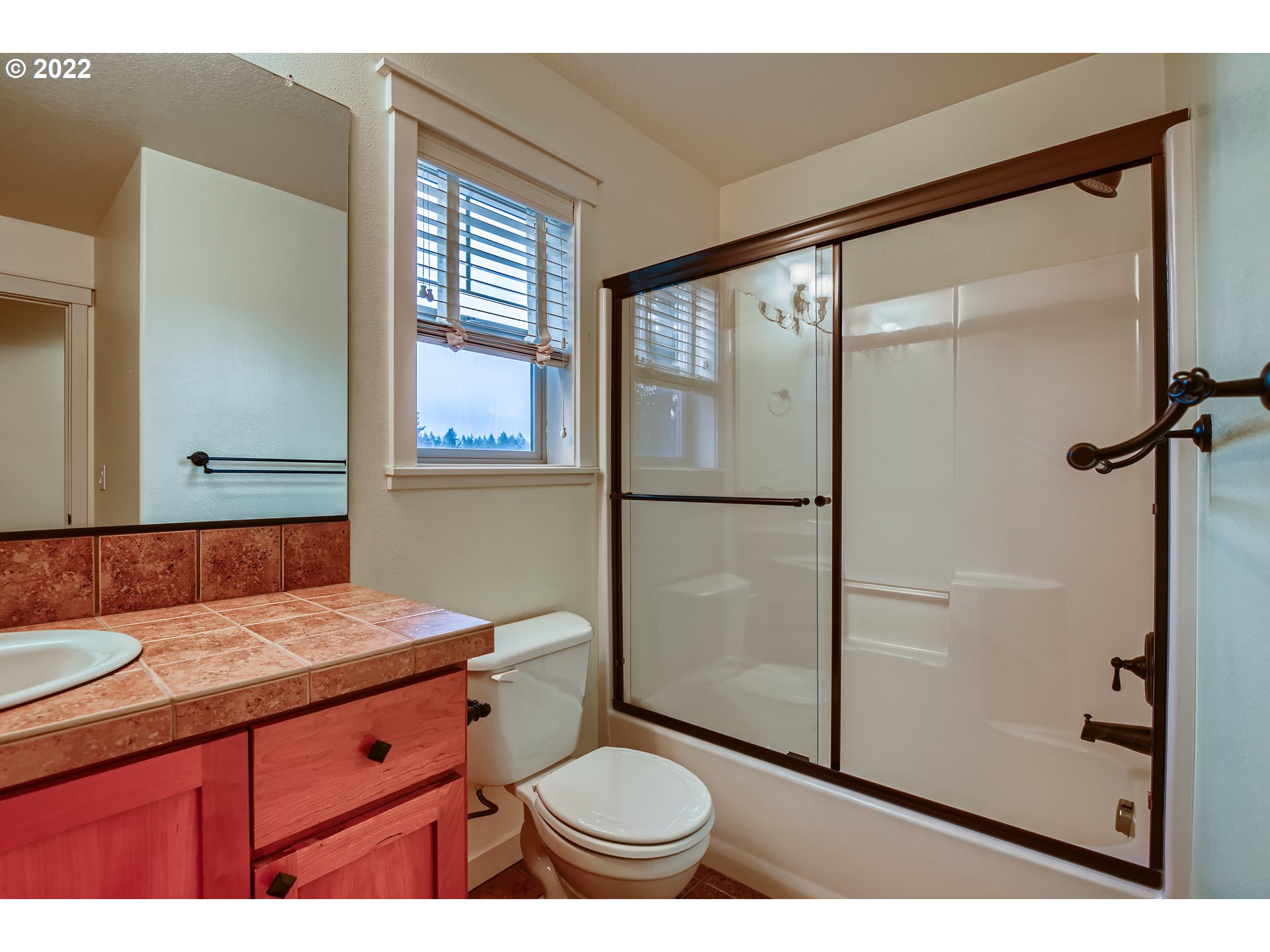 14656 Southwest 164th Avenue Tigard, OR 97224 - Photo 25 of 31 a bathroom with a granite countertop sink toilet and shower