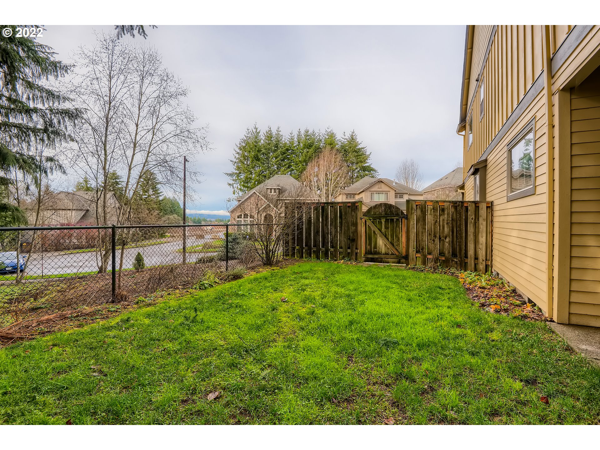 14656 Southwest 164th Avenue Tigard, OR 97224 - Photo 31 of 31 a view of a backyard with wooden fence