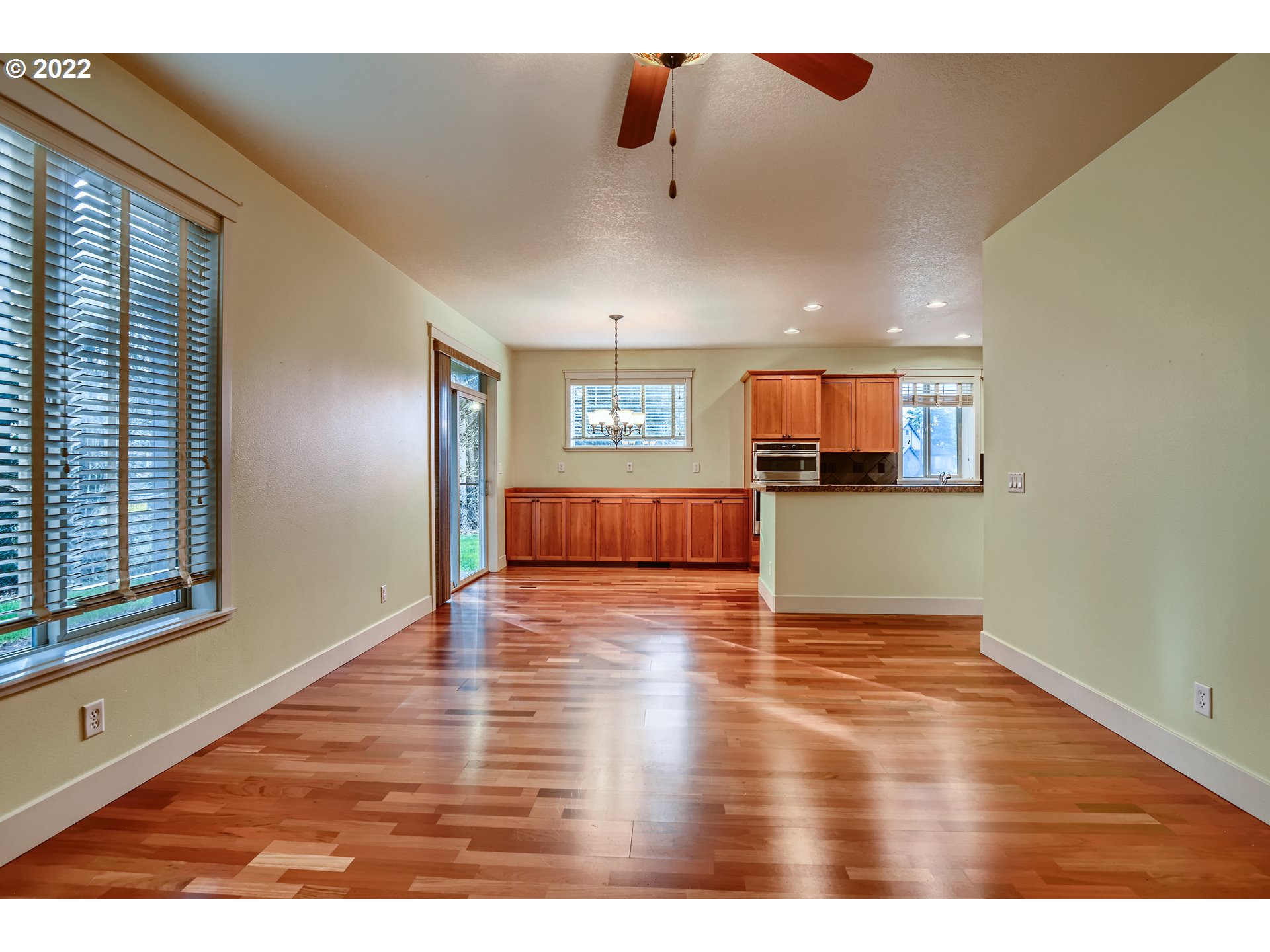 14656 Southwest 164th Avenue Tigard, OR 97224 - Photo 7 of 31 an empty room with wooden floor and windows