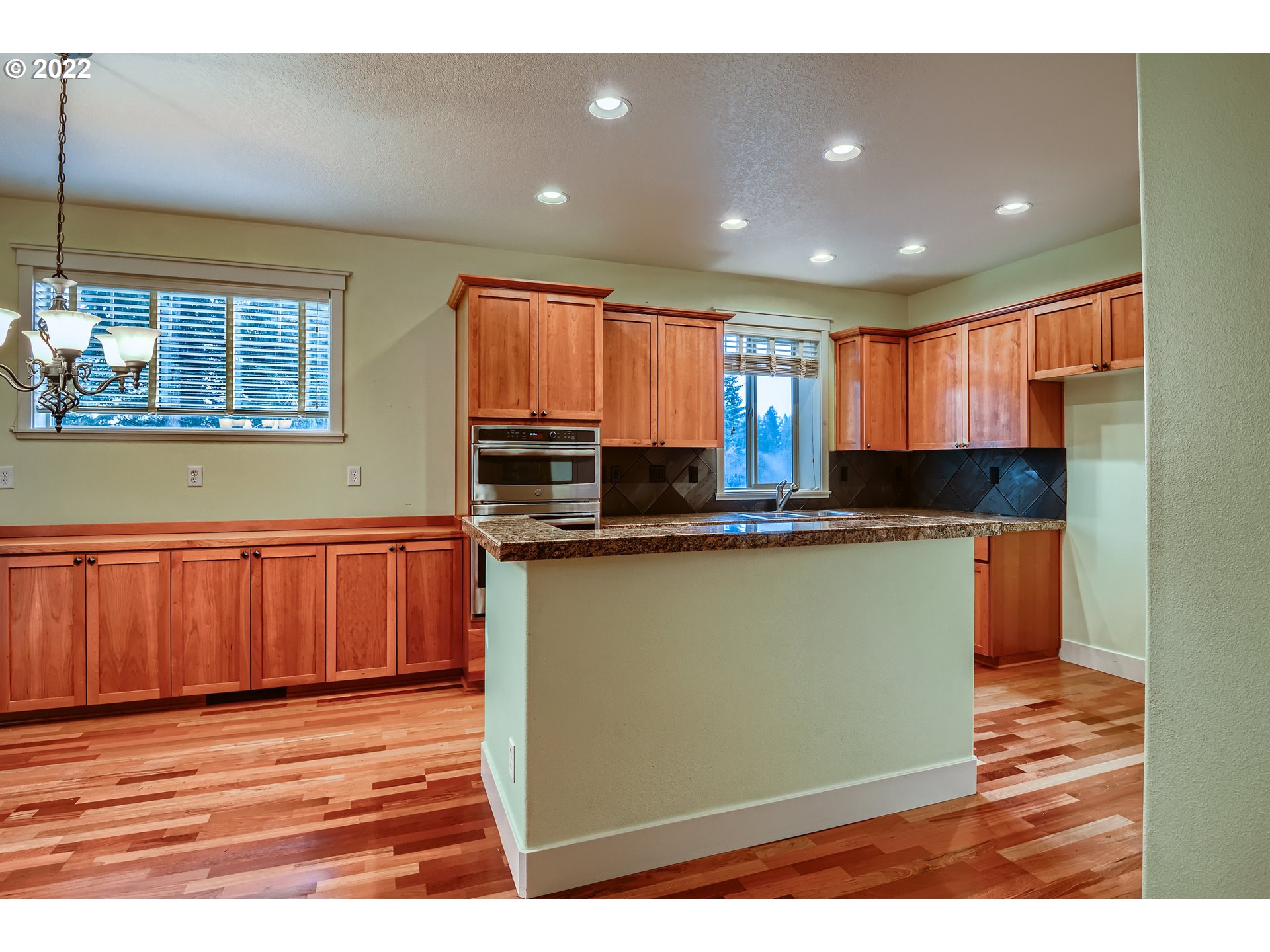 14656 Southwest 164th Avenue Tigard, OR 97224 - Photo 10 of 31 a kitchen with stainless steel appliances granite countertop a refrigerator and a sink