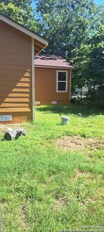 a backyard of a house with lots of green space
