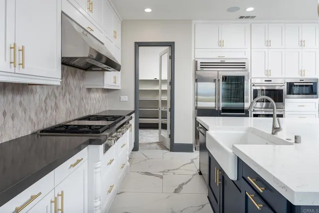 a view of an empty room with a fireplace and a floor to ceiling window