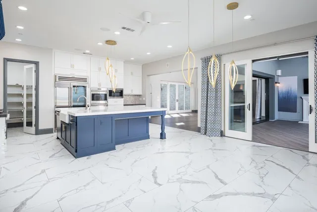 a bathroom with a bathtub a sink and a mirror