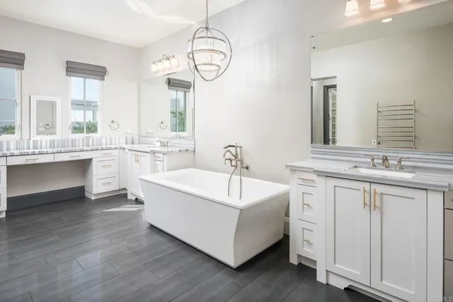 a bathroom with a shower sink and mirror