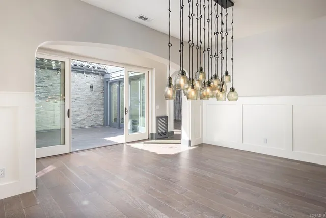a spacious bathroom with a shower sink and mirror