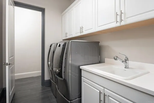 en empty room with window and a flat screen tv