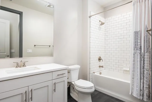 a view of a city with lush green forest